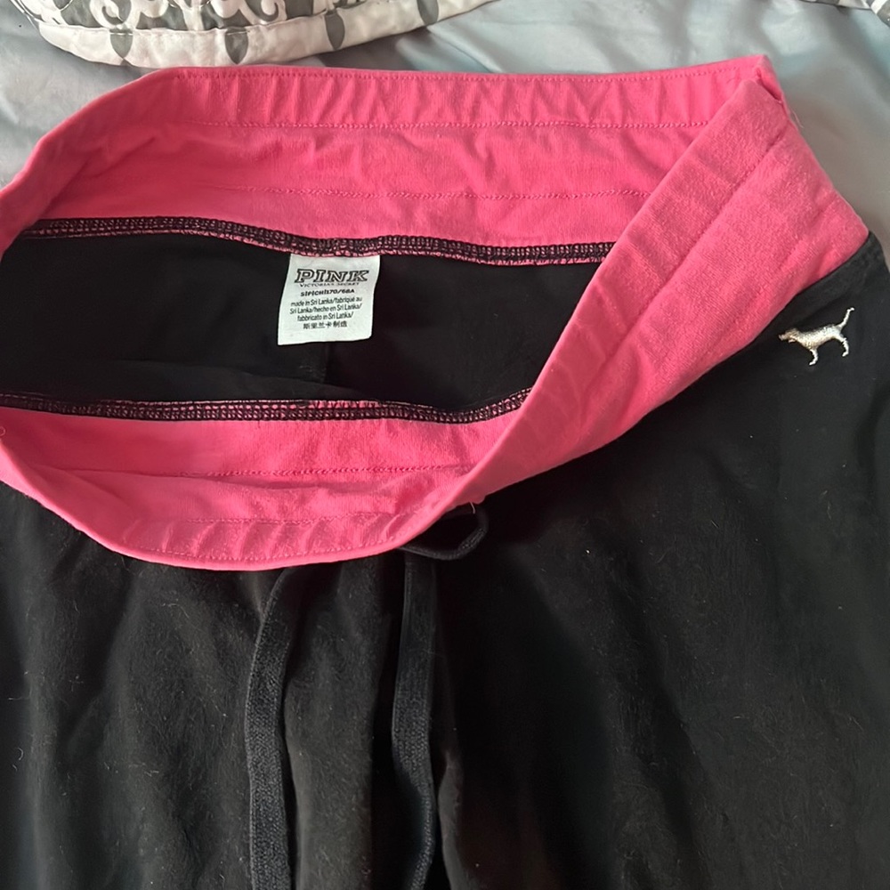 Pink leggings with tightening strings. Size Small worn a few times, Like new